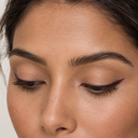 Eyeliner styling close-up — AI illustration; shade appearance is illustrative