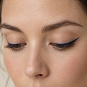 Eyeliner styling close-up — AI illustration; shade appearance is illustrative