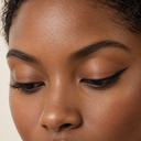 Eyeliner styling close-up — AI illustration; shade appearance is illustrative