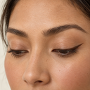 Eyeliner styling close-up — AI illustration; shade appearance is illustrative