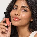 hy-lp-gls-0018-sunrise-sonnet-lip-gloss-orange-coral-1069-wear.webp
