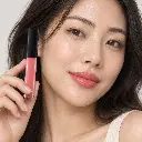 hy-lp-liq-0002-rosy-waltz-liquid-lipstick-coral-pink-1658-wear.webp